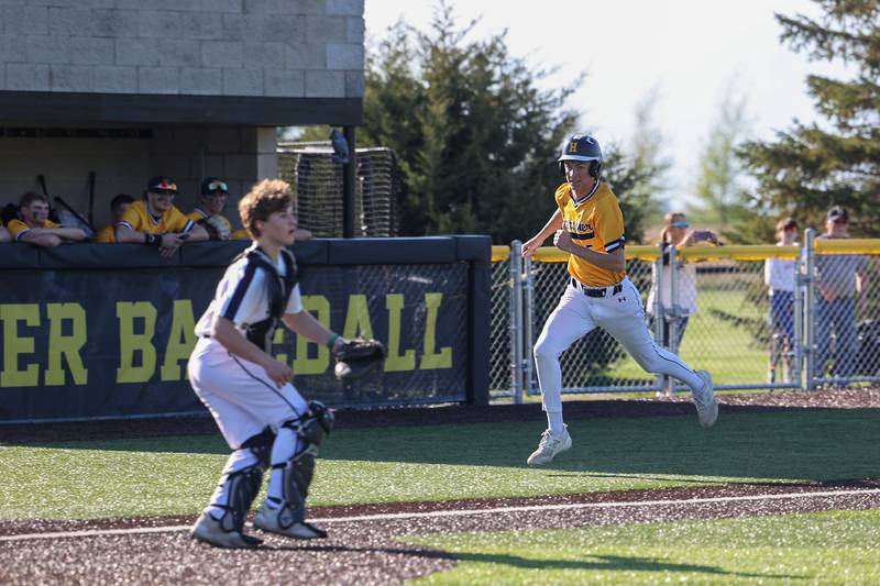 Herscher's Tanner Jones beats the throw at home to score during the Tigers’ 8-7 loss to Manteno on Tuesday, May 6, 2025.
