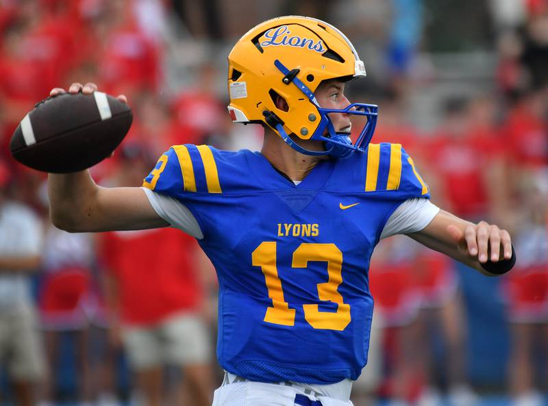 Lyons Township quarterback Jack Slightom fires a pass during a game against Hinsdale Central on September 20, 2025 at Lyons Township High School in LaGrange.