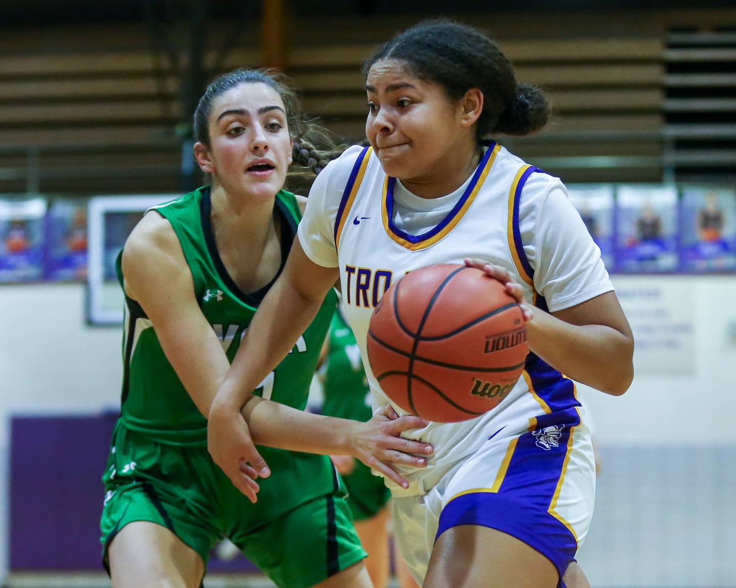Downers Grove North's Kaitlyn Parker (24) drives baseline during basketball game between York at Downers Grove North. Dec 19, 2023.