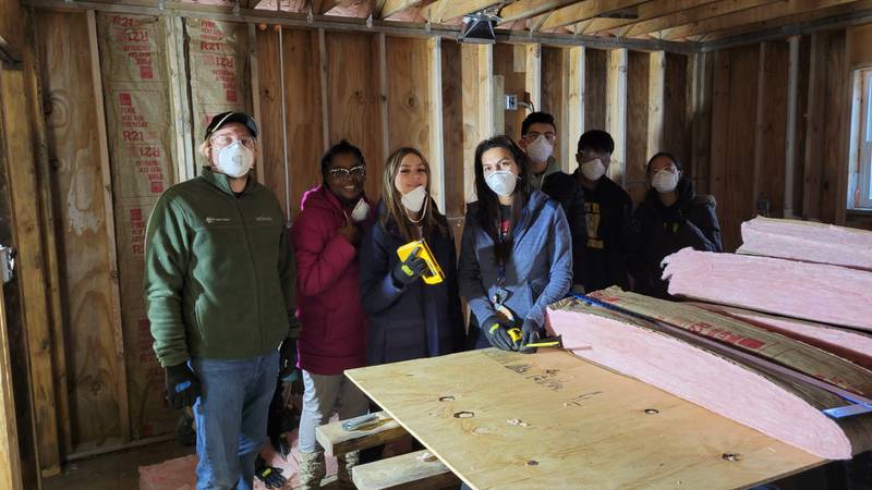 Volunteers assisting with construction tasks for Will County Habitat for Humanity at an MLK Day of Service. The MLK Day of Service planning committee is seeking service projects for the 17th annual Joliet-Area MLK Day of Service on Jan. 15, 2024.