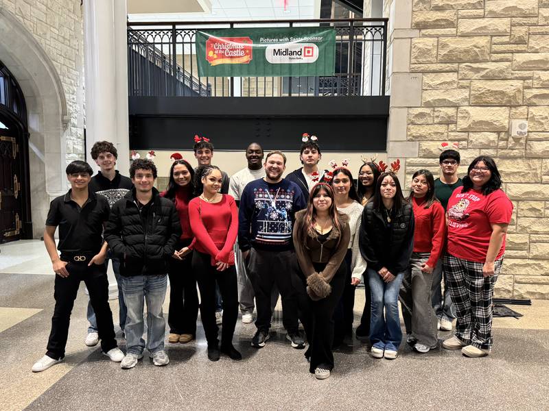 Joliet Township High School Creating Entrepreneurial Opportunities students who organized the Christmas at the Castle on Dec, 12, 2025. (From left) Back row: Henry Mastin, Caleb Christos, Gregory Lee, Carlos Arellano Murillo, David Calderon. (From left) Front row: Angel Guevara, Toribio Morales, Ariel Smith, Chaniya Cephus, Mr. Visser, Melina Martinez, Jennifer Escobedo-Garcia, Natalie Arroyo, Jahdai Aguirre, Karina Murillo Ibarra