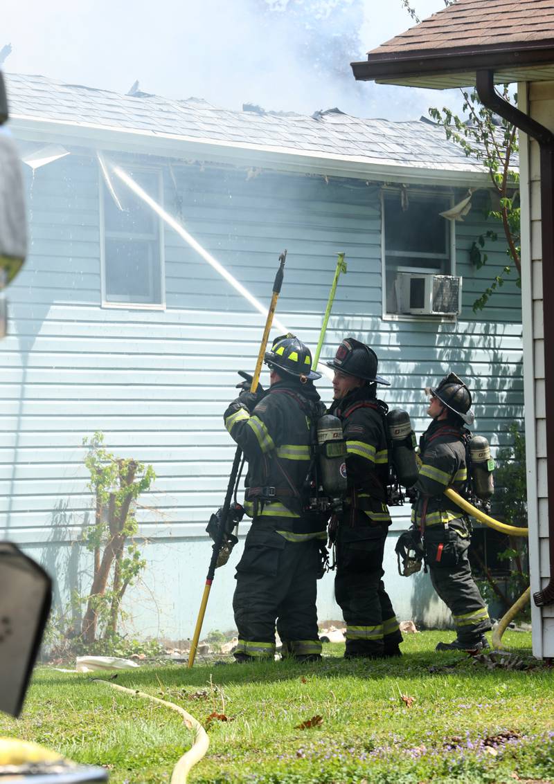 Firefighters spray water on a structure fire in the 1900 block of Main Street on Monday, May 4, 2026 in Peru.