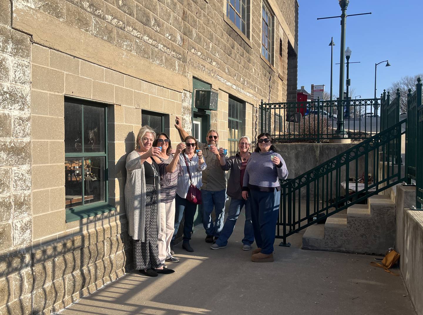 Board members of the nonprofit music organization Rosbrook celebrate the purchase of their new space at 90 S. Ottawa Ave in Dixon Thursday, March 13, 2025.