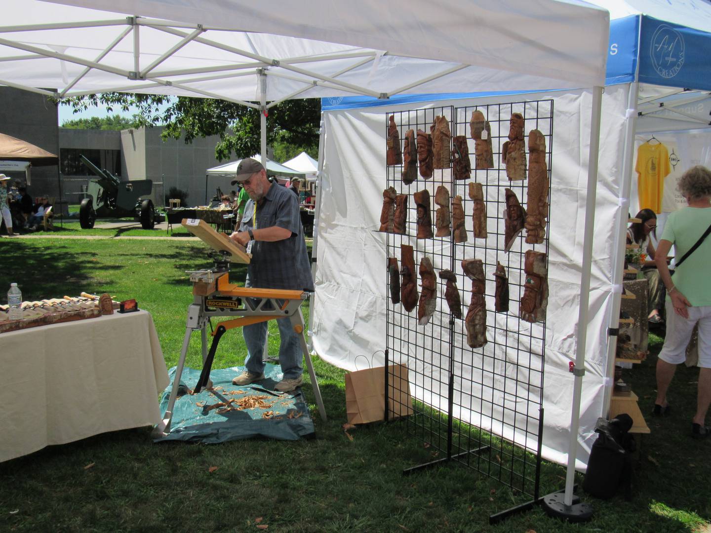 Minooka-based wood-carving artist Bud Hessling creates artwork during the Liberty Arts Festival.