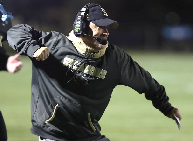 Sycamore's head coach Joe Ryan reacts to his team scoring a touchdown during their game against Morris Friday, Oct. 21, 2022, at Sycamore High School.