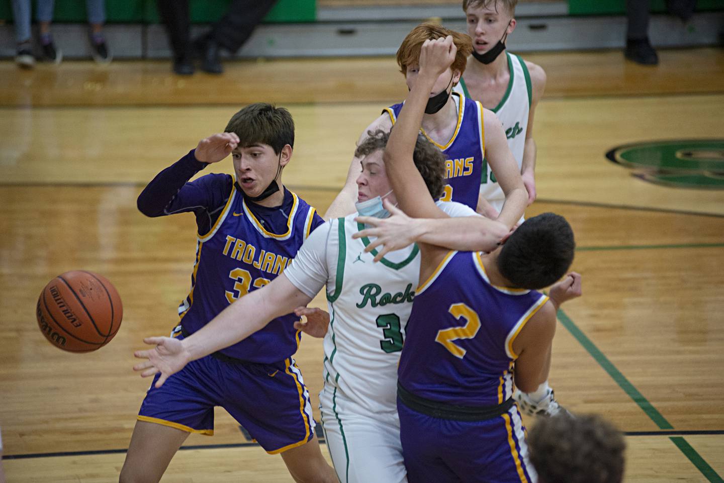 Rock Falls' Devin Schultz and Mendota's Isaac Guzman get tangled up below the basket on Saturday, Jan. 22, 2022.