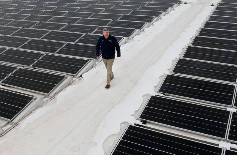 Mike Kloss, of Waukegan, chief operating officer, walks on the new solar roof of his warehouse at Kloss Distributing in Gurnee. The SunPower solar panels were installed by the General Energy Corporation. Kloss Distributing is a beer distributor which serves communities and their businesses in Lake County since 1973. (1/18/21)