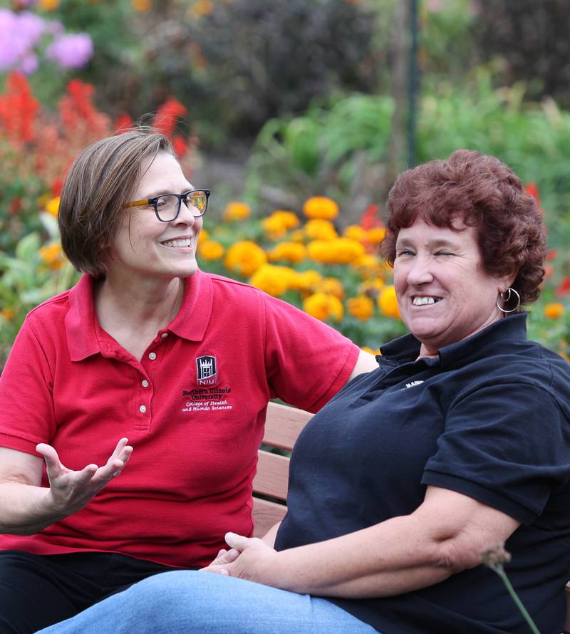 Sherrill Morris (left) from DeKalb and Diane Handlen, chat on a bench on the grounds of the Elwood House in DeKalb Friday, Sept. 23, 2022, during Handlen's visit to the area from the state of Maine. Morris and Handlen have been pen pals since the 1970's and recently met each other in person for the first time.
