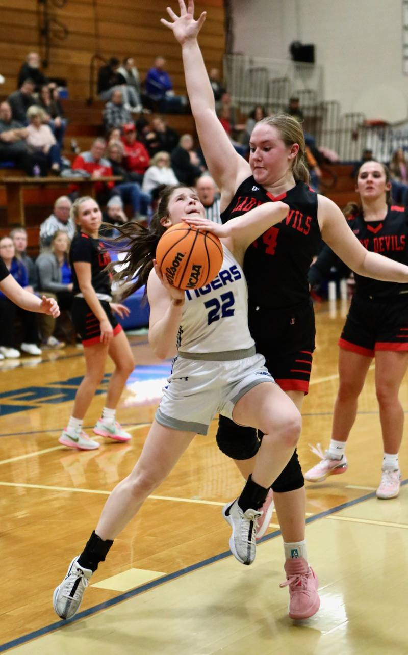 Princeton's Camryn Driscoll takes it to Hall's Ella Sterling in Thursday's game at Prouty Gym. The Tigresses won 34-30.