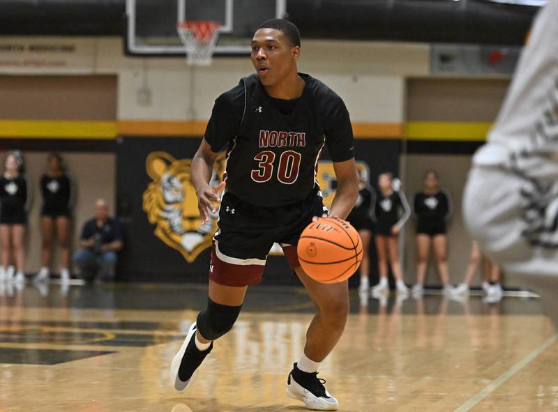 Plainfield North's Pierre Pointer (30) in action during a conference game against Joliet West on Friday, Dec. 20, 2024, at Joliet.