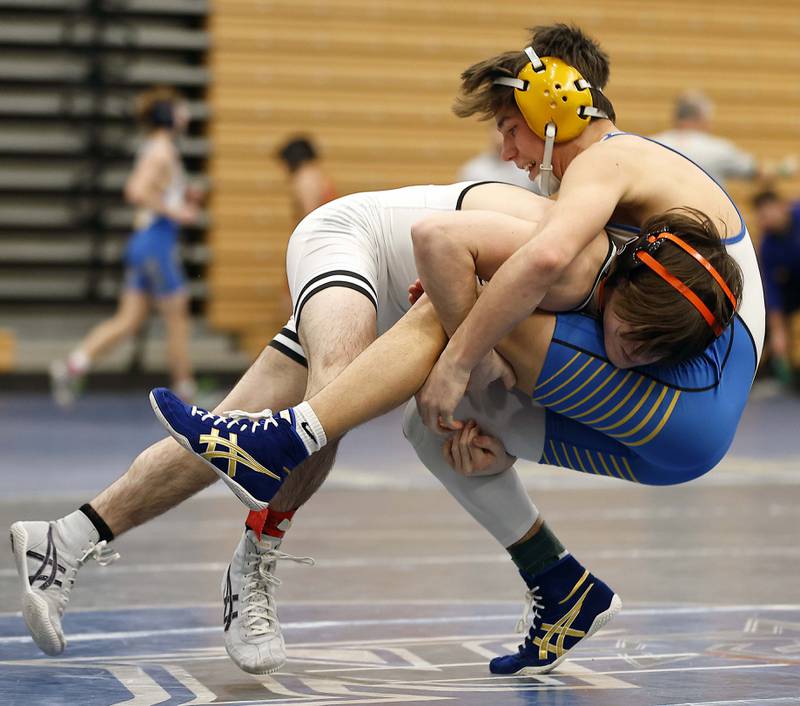 St. Charles East’s Dom Munaretto wrestles Wheaton North’s Rocco Maciellaio at 120-lbs at the 2025 DuKane Boys Varsity Tournament Saturday, Jan. 25, 2025 in St. Charles.