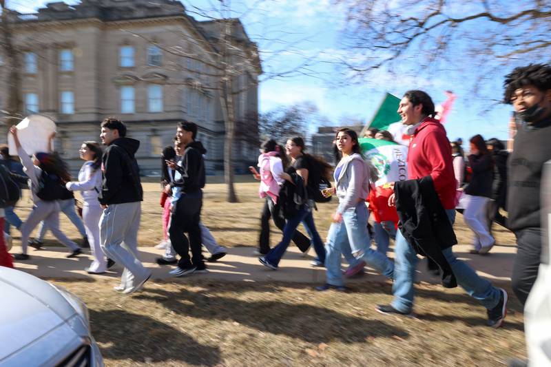 Kankakee High School students pass by the Kankakee County Courthouse as they participate in a walkout in protest of national immigration policies and Immigration and Customs Enforcement actions on Friday, Feb. 13, 2026.