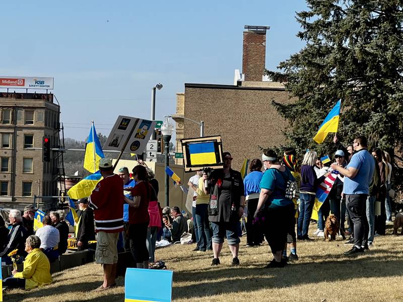 A crowd gathers on the lawn of the Old Lee County Courthouse in Dixon to show support for Ukraine during a vigil on March 13, 2025.
