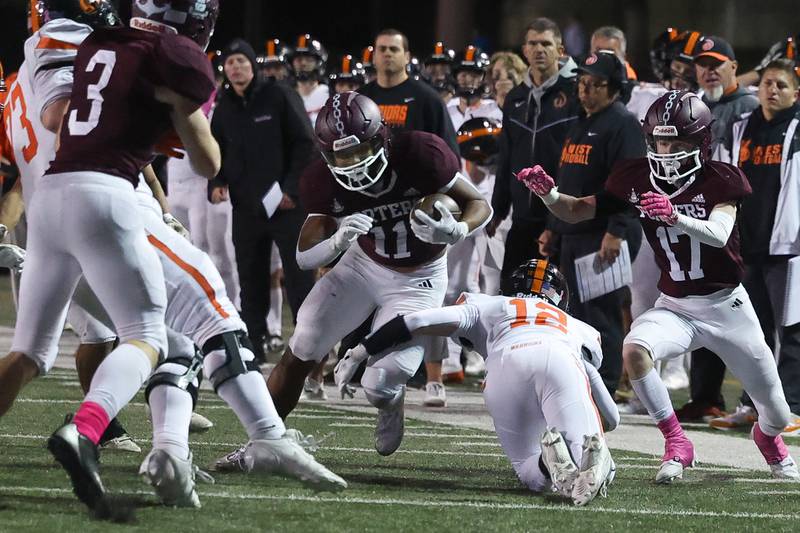 Lockport’s John Sherrod returns a fumble to set up an eventual touchdown against Lincoln-Way West on Friday, Oct. 18, 2024 in Lockport.