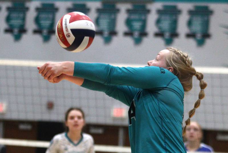 Woodstock North’s Devynn Schulze passes the ball against Woodstock in varsity volleyball at Woodstock North Monday night.