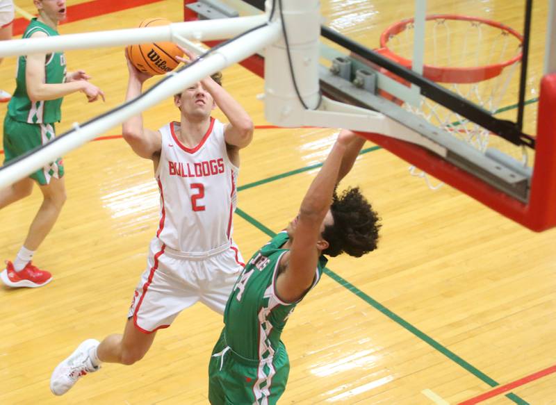 Streator's Matt Williamson eyes the hoop as L-P's Marion Persich defends the lane during the Class 3A Regional title game on Friday, Feb. 28, 2025 in Sellett Gymnasium at L-P High School.