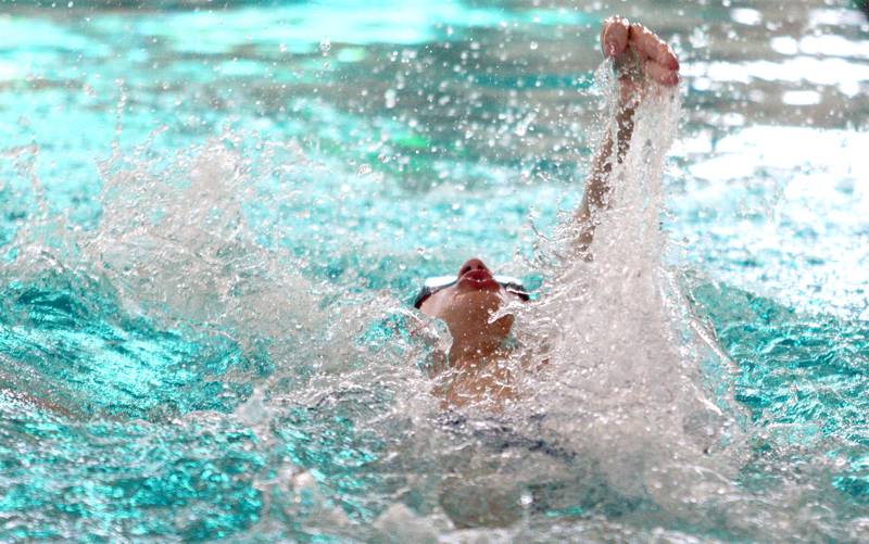 Jacobs’ co-op’s Gabe Niemi competes in the 100-yard backstroke at the Fox Valley Conference Boys Swimming Invite at Woodstock North on Saturday.