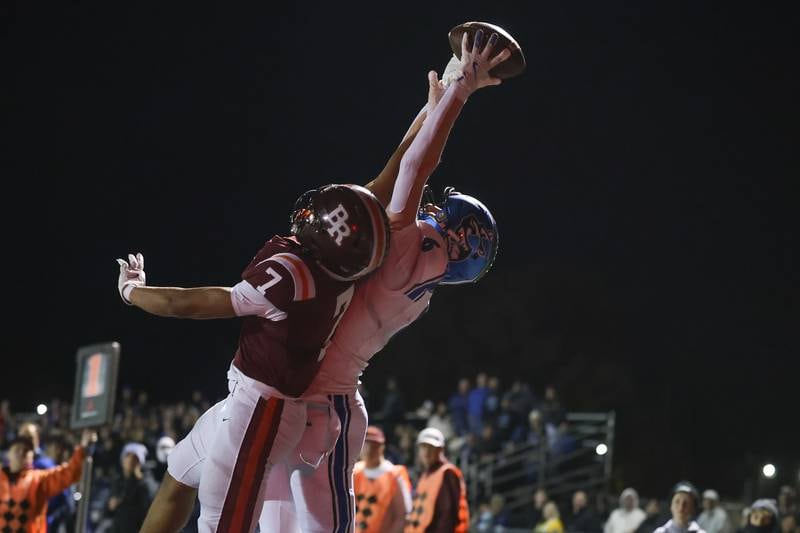 St. Charles North's Keaton Reinke draws the pass interference on a near touchdown catch against Brother Rice in the third round of the playoffs on Saturday, Nov. 15, 2025 in Chicago.