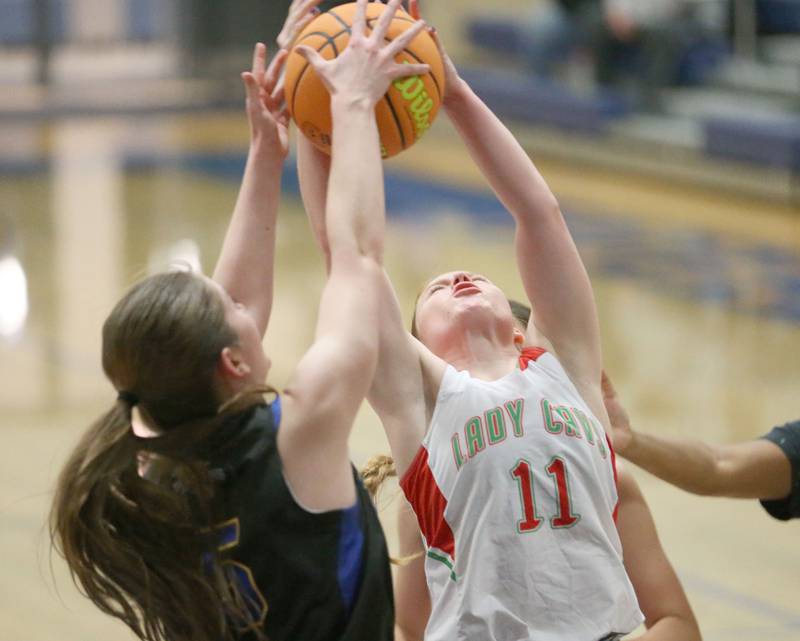 L-P's Elizabeth Sines grabs a rebound over Somonauk's Aubrey Chiavario during the Tim Humes Breakout Tournament on Friday, Nov. 22, 2024 at Somonauk High school.