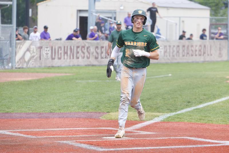 Waubonsie’s Owen Roberts scores a run in the first inning against Downers Grove North at the Class 4A Sectional Final on Saturday, June 7, 2025 in Lockport.