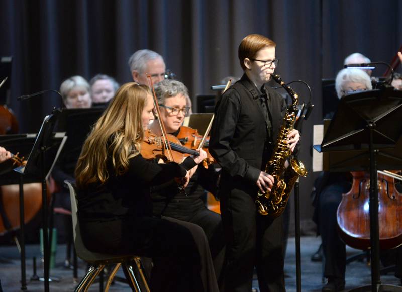 Rileigh Wren plays the saxophone with the Clinton Symphony Orchestra during the Family Concert on Sunday, Feb. 23, 2025 in the Morrison High School Auditorium.