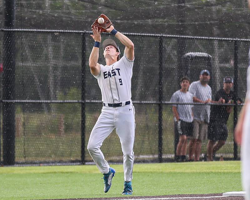 Oswego East's Josh Polubinski (9) makes a catch during Class 4A Romeoville Sectional semifinal between Oswego East at Downers Grove North.  May 31, 2023.
