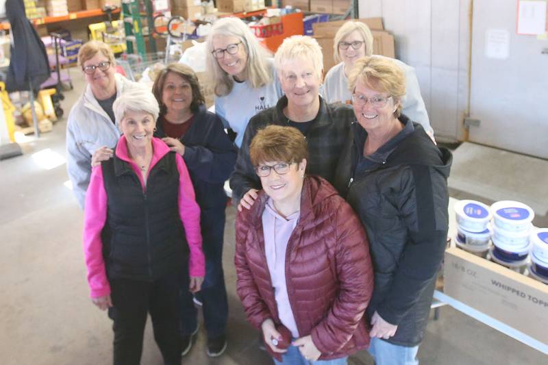 A group of volunteers pose for a photo during the annual Thanksgiving distribution on Wednesday, Nov. 20, 2024 at the Hall Township Food Pantry in Spring Valley.