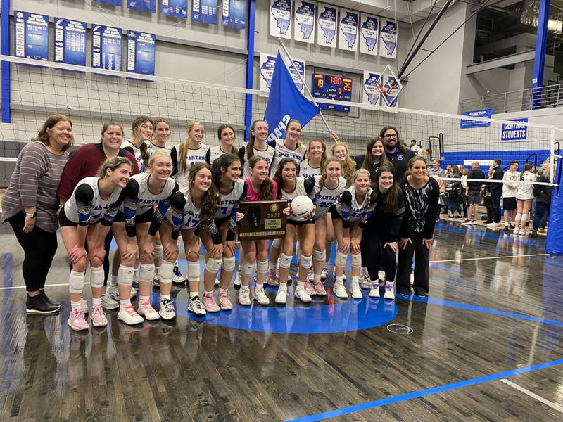 The St. Francis volleyball team poses with the sectional plaque after beating Kaneland to win the Class 3A Burlington Central Sectional championship.