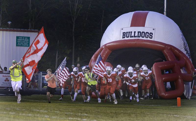 Members of the Streator football team run onto the field against Lisle on Friday, Sept. 16, 2022 at Dieken Stadium in Streator.