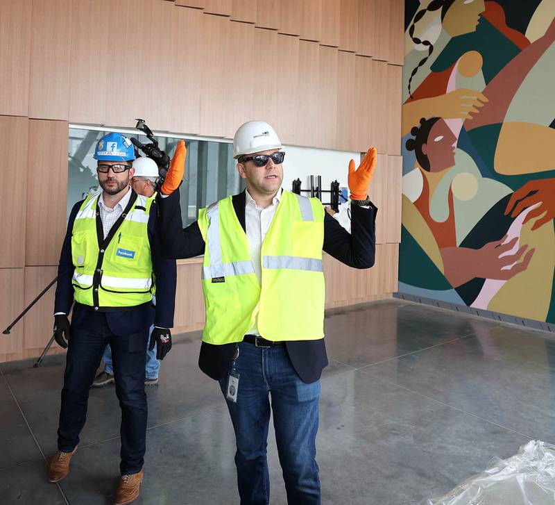 Matt Sexton, community development manager at Meta, (right) and Stefan Kasan, infrastructure construction manager and site lead at Facebook's parent company, Meta, talk about the site Wednesday, April 27, 2022, during a tour at the Meta DeKalb Data Center. Meta announced Wednesday it will expand its DeKalb facility by two buildings, with a local investment expected to top $1billion.