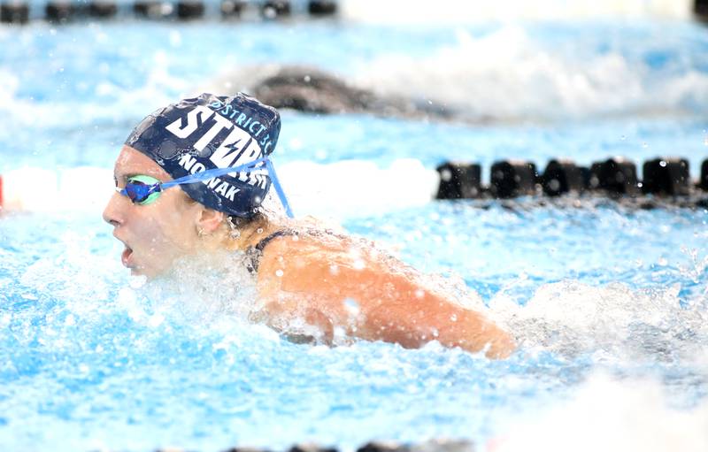 Dundee-Crown’s Maggie Nowak competes in the 100-yard butterfly consolation heat during the IHSA Girls State Championships on Saturday, Nov. 16, 2024 at FMC Natatorium in Westmont.
