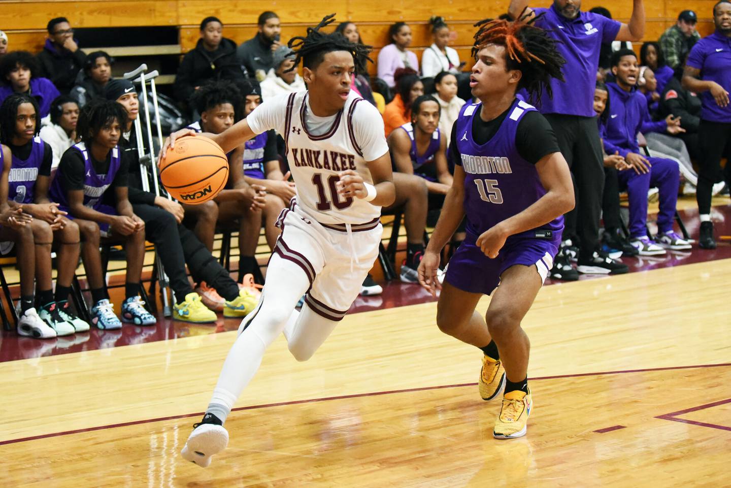 Kankakee's Kenaz Jackson, left, drives past Thornton's Jeremy Blanco-Rios during Tuesday's game at Kankakee.