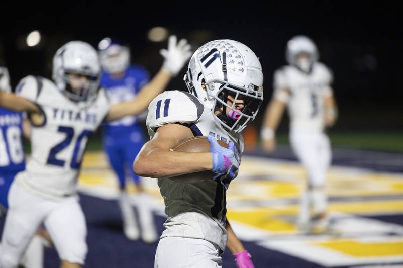 Monmouth-Roseville’s Payton Thompson crosses the goaline to put the Titans up by 13 against Newman Friday, Oct. 25, 2024, at Roscoe Eades Stadium in Sterling.