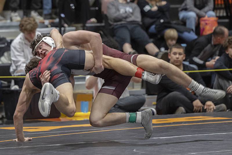 West Chicago’s Lincoln Hoger takes down Amboy’s Calden Heath in the 144 pound third place match Saturday, Feb. 14, 2026, during the Class 1A wrestling sectionals in Byron.