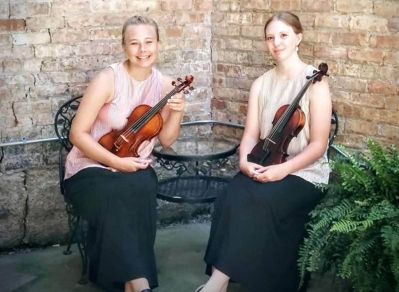 Eva Peterson and Emma Fredericks are the two Sycamore High School violinists who make up their musical group Eva & Emma: Classical Duettes.