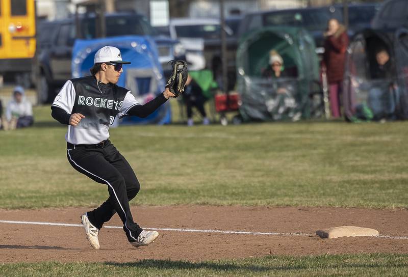 Rock Falls’ Alex Espinoza touches first for the second out in a triple play against Princeton Thursday, March 27, 2025.