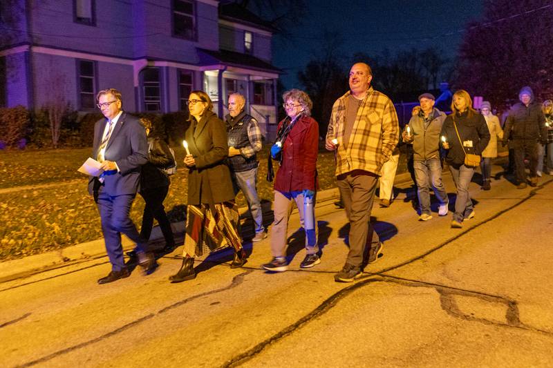 Locals walk to the Peace on Earth Bridge as part of the International Peace Vigil on Sunday, Nov. 23, 2025, in Batavia.