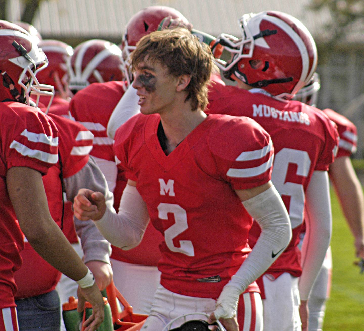 Morrison's Camden Pruis celebrates with teammates following an interception against Fulton.