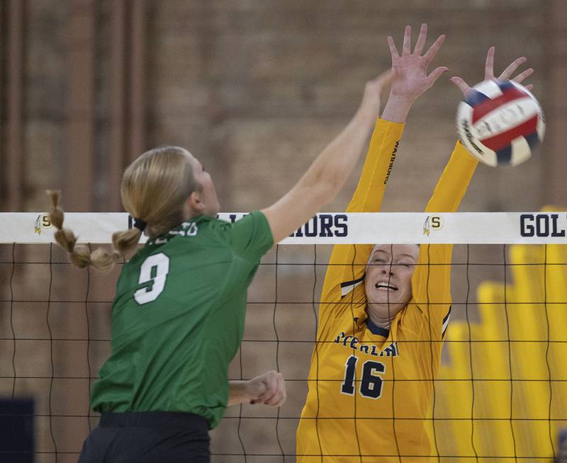 Sterling’s Kasey Weeks goes up for a block against Geneseo’s Elli Barickman Tuesday, Sept. 30, 2025.