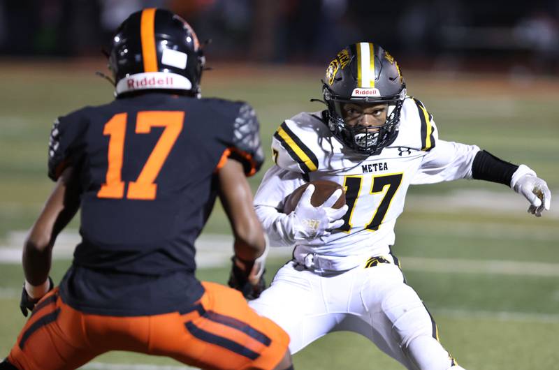 Metea Valley's Christian Anthany Smith looks to get by DeKalb's Jayden Wilson during their game Friday, Sept. 16, 2022, at DeKalb High School.