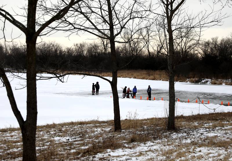 Historical interpreters and participants gather on Timber Lake at Kline Creek Farm to harvest ice on Friday, Jan. 24 2025 in West Chicago.