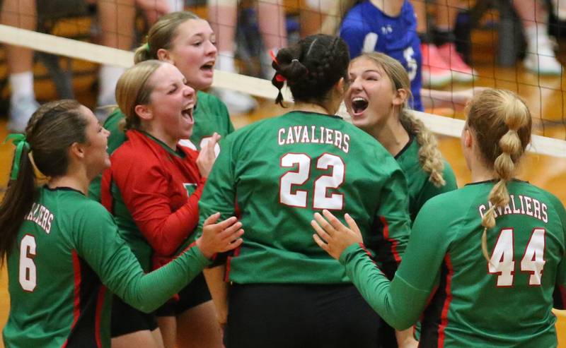 Members of the L-P volleyball team react after winning the first set against Princeton on Tuesday, Aug. 27, 2024 at Princeton High School.