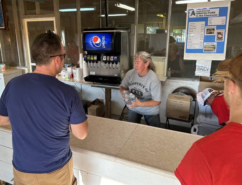 Melinda Charboneau, Ogle-Lee Ag in the Classroom coordinator, was busy waiting on customers at the Ag in the Classroom concession stand at the Ogle County Fair on Friday, Aug. 2, 2024.