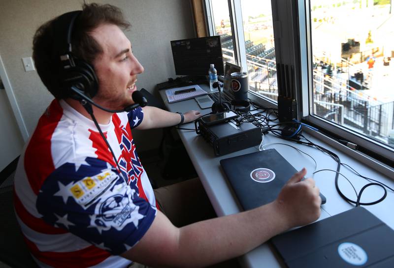 Illinois Valley Pistol Shrimp announcer Lucas Burris calls plays from the booth during a game against the Normal Cornbelters on Tuesday, June 20, 2023 at Schweickert Stadium in Peru.