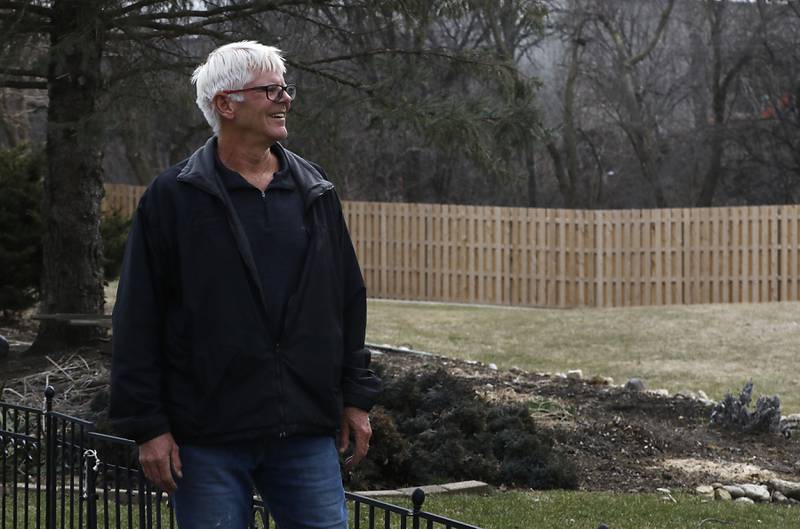 Mark Cordes in his backyard near the Union Pacific Railroad tracks that run through Crystal Lake on Tuesday, March 21, 2023.