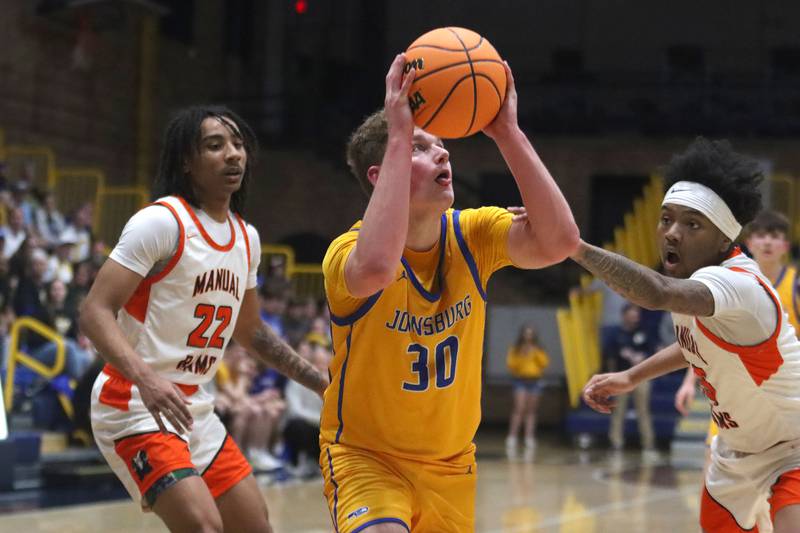 Johnsburg’s Jayce Schmitt moves the ball against Peoria Manual in boys IHSA Class 2A Supersectional basketball on Monday, Mar. 9, 2026, at Sterling High School in Sterling.