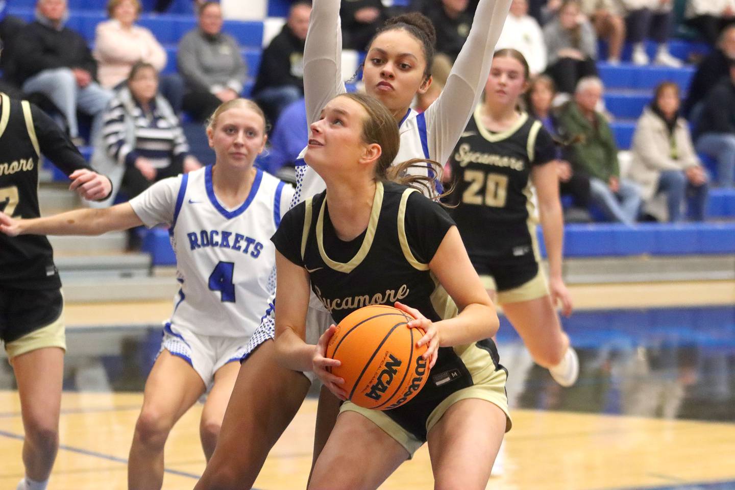 Sycamore’s Sydney Fabrizius works under the hoop in girls basketball at Burlington Central High School in Burlington on Tuesday, November 18, 2025.