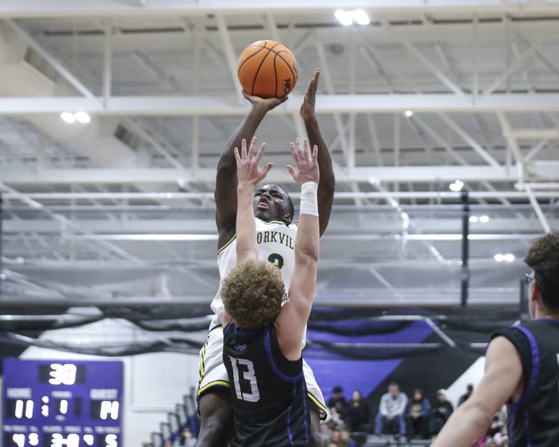 Yorkville Christian's Jayden Riley (3) shoots a jumper over Plano's Finley Winter (13) during their Plano Christmas Classic semi-final basketball game between Yorkville Christian at Plano Monday, Dec 29, 2025 in Plano.