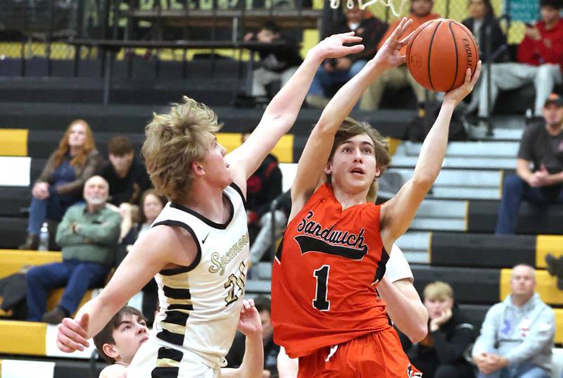 Sandwich's Sammy Legget tries to shoot around Sycamore's Lucas Winburn during their game Tuesday, Jan. 17, 2023, at Sycamore High School.