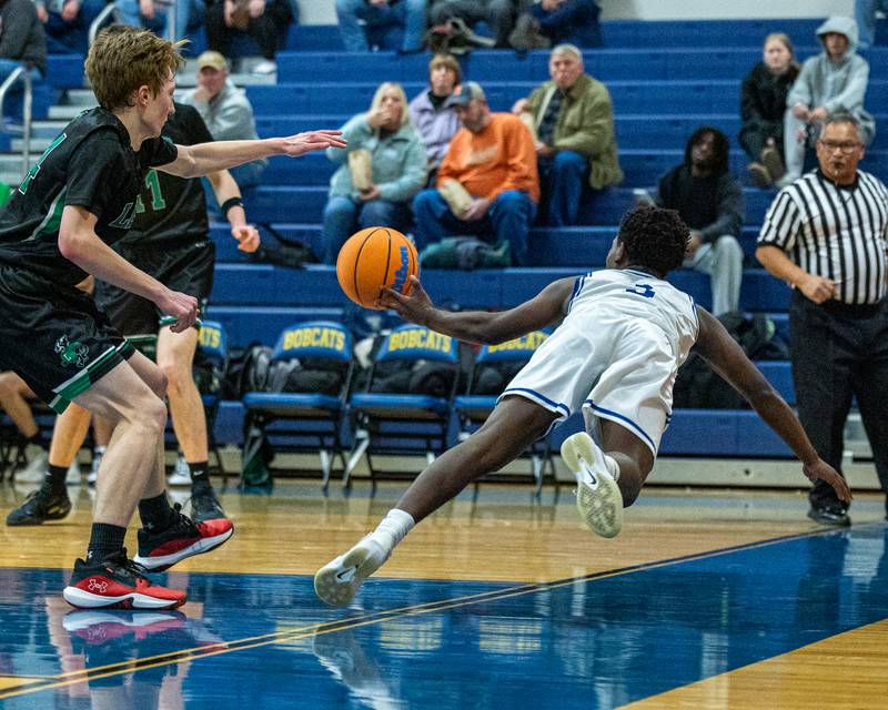 Reggie Chapman (3) of Newark dives to save ball from falling out of bounds in game against Leland during the quarterfinals of the Little Ten Conference Tournament on Monday, Feb. 2, 2026 at Somonauk High School in Somonauk.